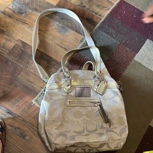 Medium cream colored Coach cross body purse